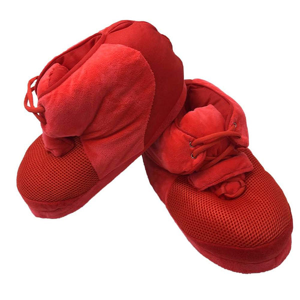 A pair of luxurious unisex slippers made from premium faux fur, local cotton, and wool, showcasing a rubber dot sole. The slippers are designed for both indoor and outdoor use, emphasizing their ultimate comfort with ultra plush foam. A promotional message offers 50% off the second pair with code HALFOFF.