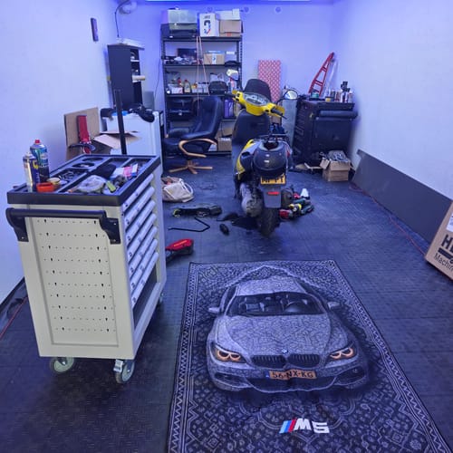 BMW-inspired rug displayed inside a garage